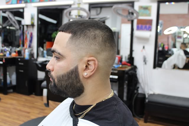 Sharp fade and shaped full beard