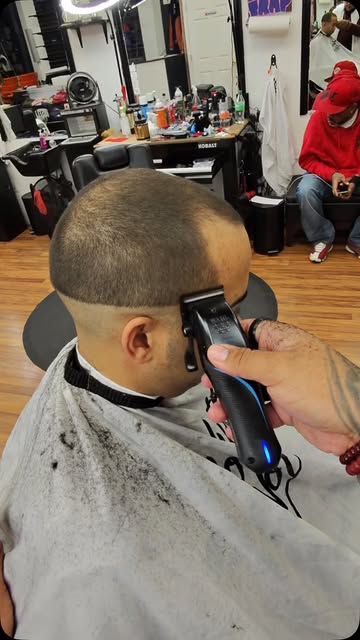 Rafael Padilla Jr refining a fade with clippers