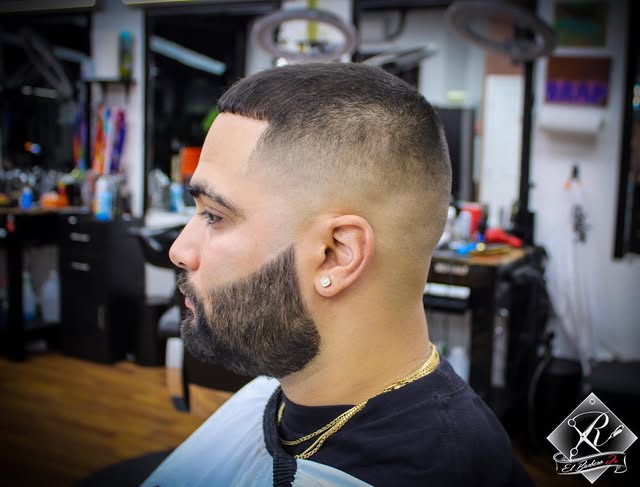 Precision fade with a sculpted full beard